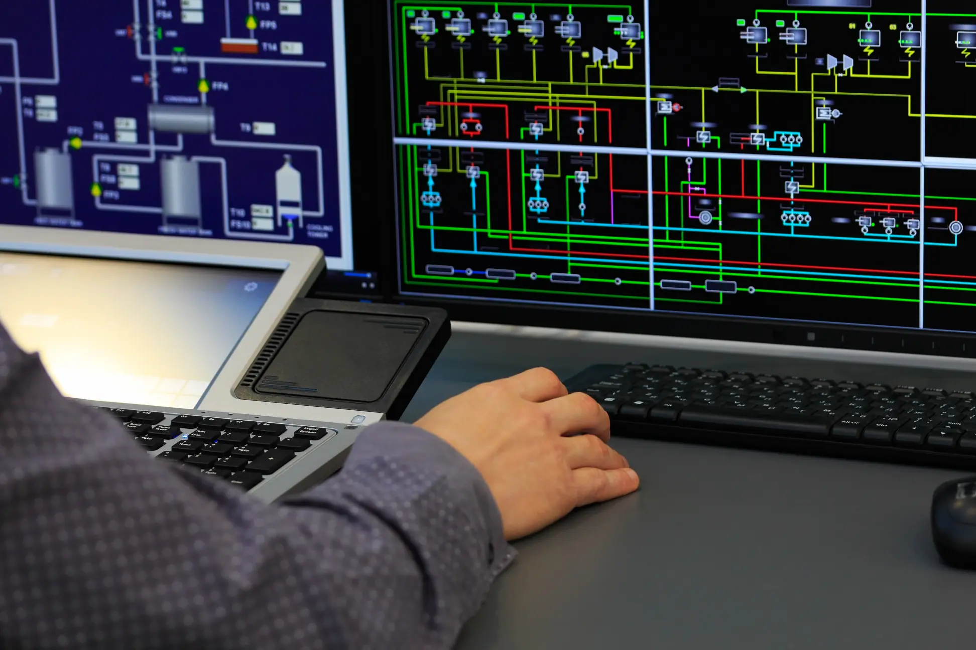 person inspects screen with diagram of conditional logic